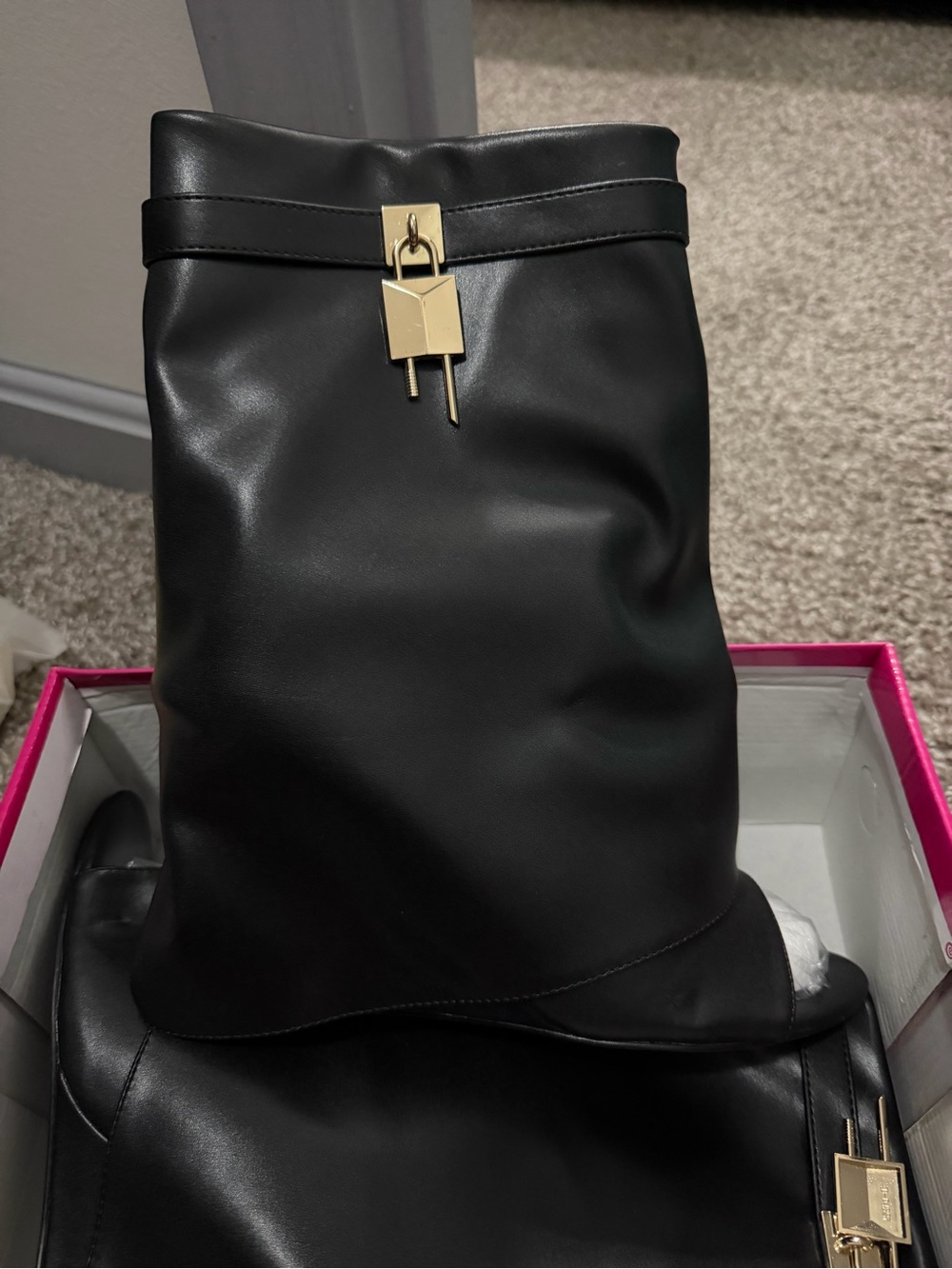 Black Leather Backpack with Gold Lock Accent